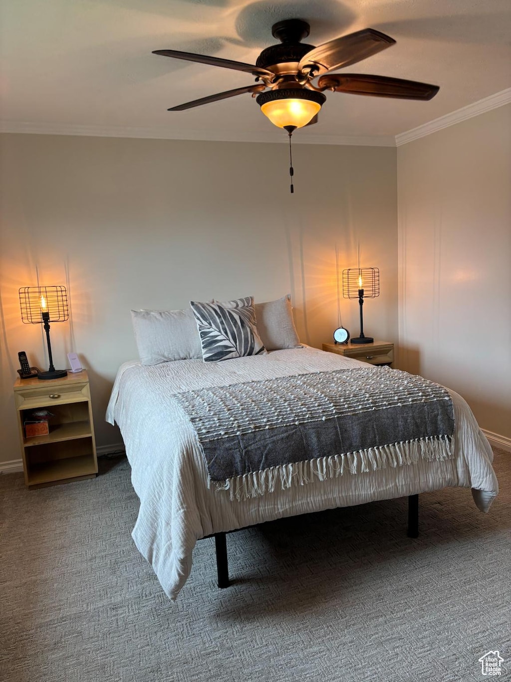 2165 W Tierra Rose Dr, Taylorsville, UT 84129 - bedroom with crown molding, carpet flooring, and ceiling fan
