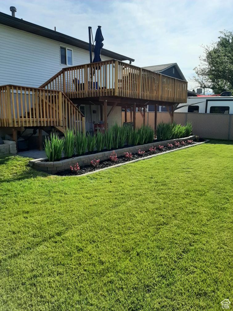 2165 W Tierra Rose Dr, Taylorsville, UT 84129 - back of property featuring a deck and stairs