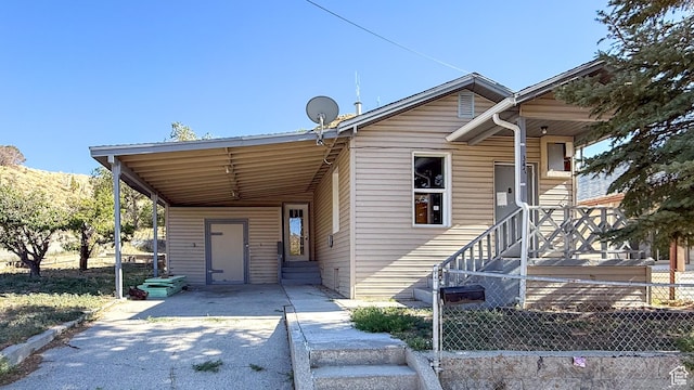 347 Hill St, Helper, UT 84526 - view of front facade with concrete driveway, a carport, and entry steps