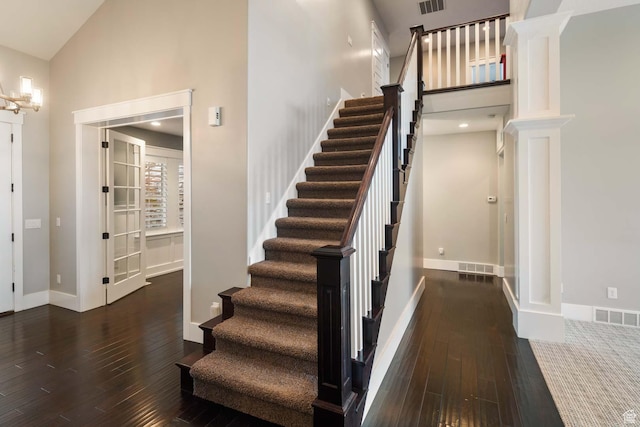 5843 W Wildflower Ln, Highland, UT 84003 - stairs with high vaulted ceiling, hardwood / wood-style floors, and decorative columns