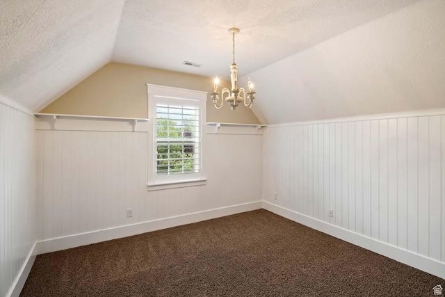 5843 W Wildflower Ln, Highland, UT 84003 - additional living space with a textured ceiling, a chandelier, lofted ceiling, and dark colored carpet
