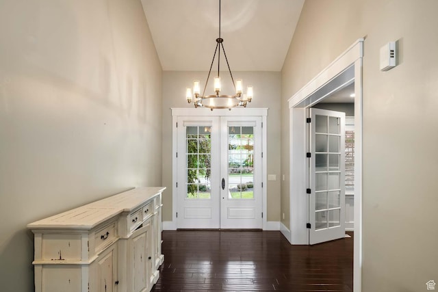 5843 W Wildflower Ln, Highland, UT 84003 - doorway featuring a chandelier, french doors, dark wood-style floors, and vaulted ceiling