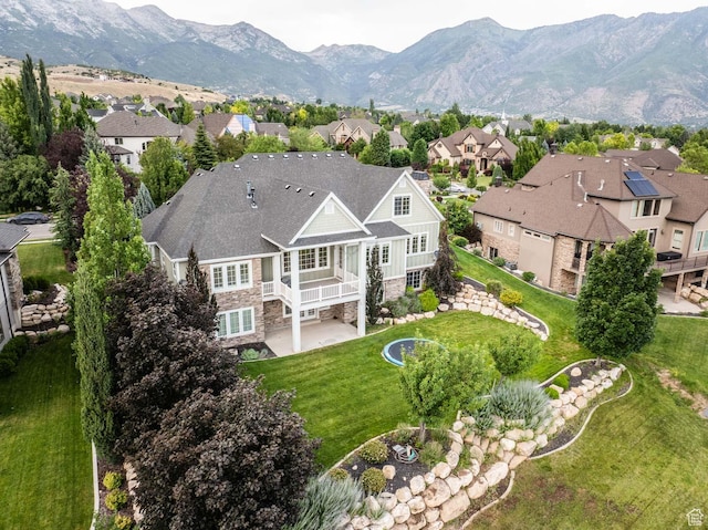 5843 W Wildflower Ln, Highland, UT 84003 - aerial view of residential area with a mountain backdrop