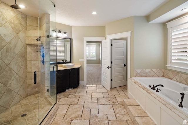 5843 W Wildflower Ln, Highland, UT 84003 - full bathroom with vanity, a garden tub, a shower stall, and recessed lighting