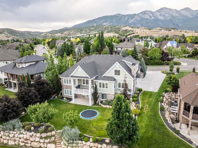 5843 W Wildflower Ln, Highland, UT 84003 - aerial perspective of suburban area featuring a mountainous background