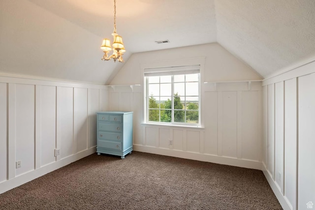5843 W Wildflower Ln, Highland, UT 84003 - bonus room with a decorative wall, lofted ceiling, carpet, a chandelier, and a textured ceiling