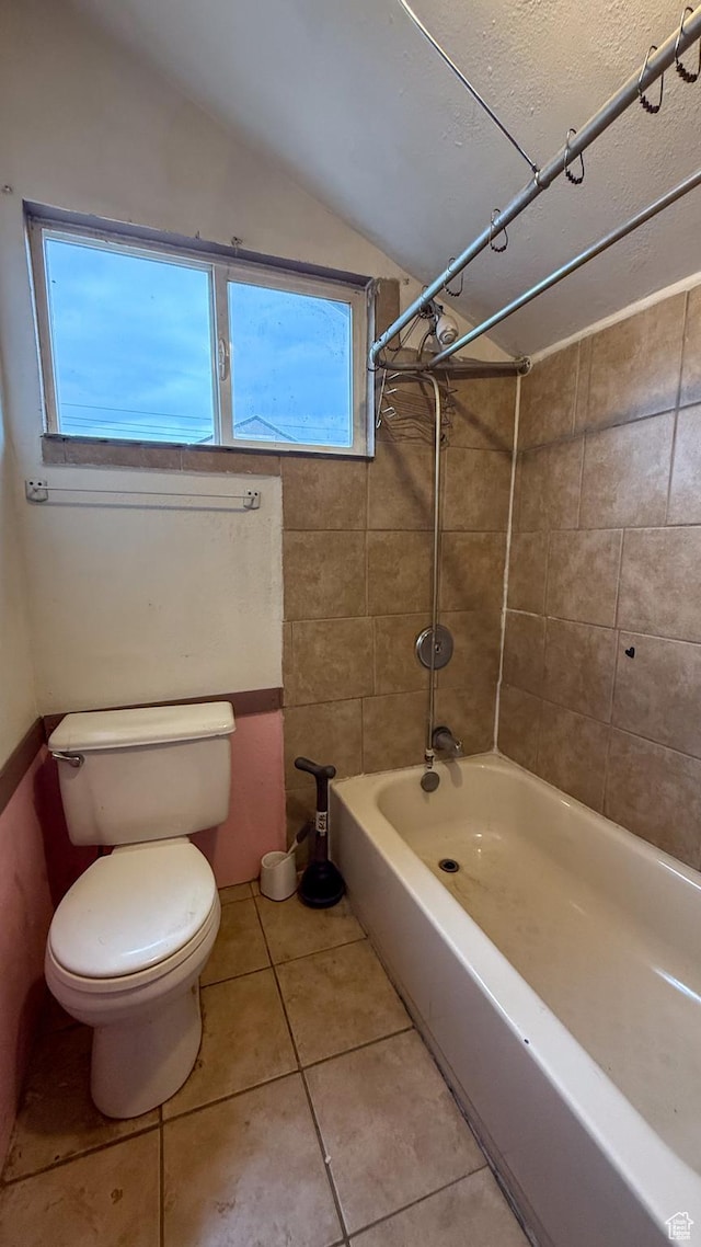 127 Grassy Dr, East Carbon, UT 84520 - bathroom featuring shower / bath combination, lofted ceiling, and tile patterned flooring