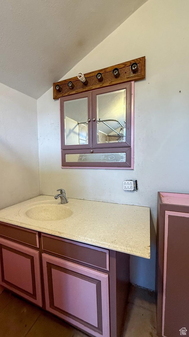 127 Grassy Dr, East Carbon, UT 84520 - bathroom with lofted ceiling and vanity