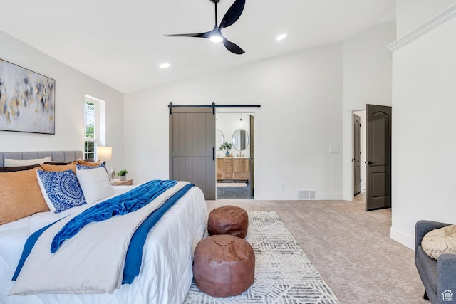 12060 S Lampton Dr W, Riverton, UT 84065 - carpeted bedroom featuring vaulted ceiling, a barn door, connected bathroom, recessed lighting, and ceiling fan