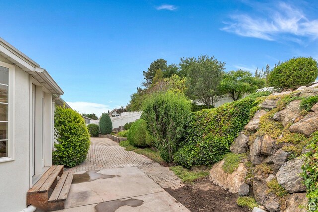 12060 S Lampton Dr W, Riverton, UT 84065 - view of yard with a patio area