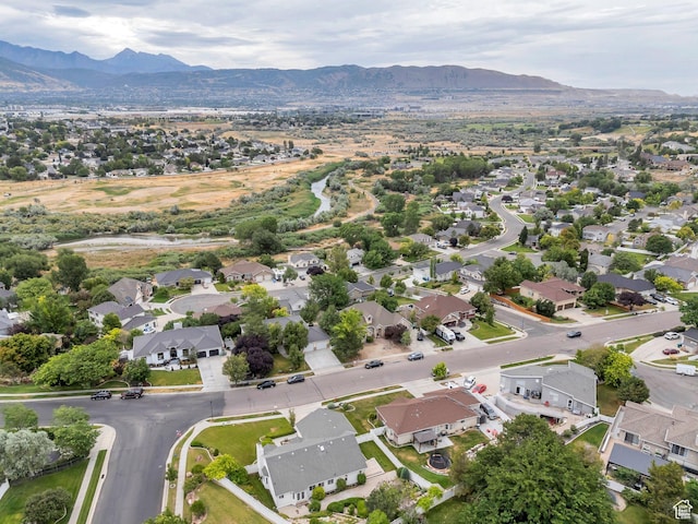 12060 S Lampton Dr W, Riverton, UT 84065 - aerial view of property and surrounding area featuring nearby suburban area and a mountainous background
