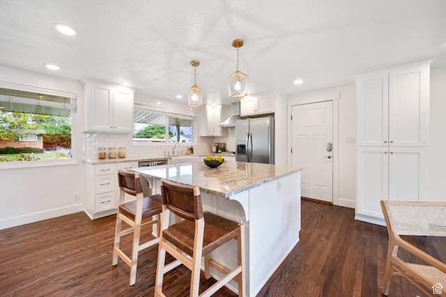 1767 N 1400 W, Provo, UT 84604 - kitchen featuring stainless steel refrigerator with ice dispenser, dark wood finished floors, white cabinets, decorative backsplash, and recessed lighting