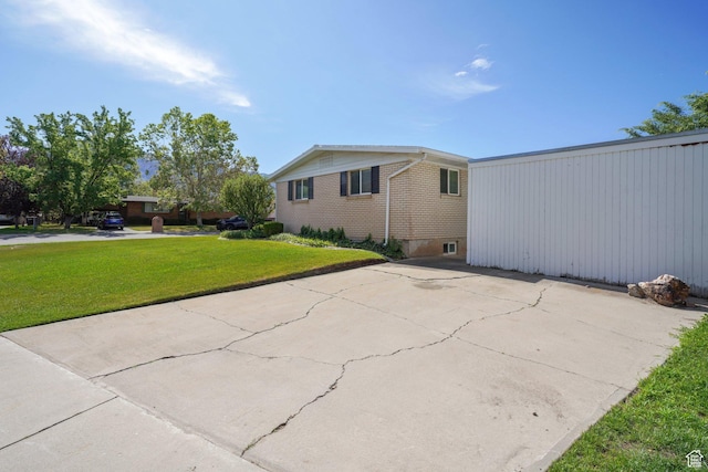 1767 N 1400 W, Provo, UT 84604 - view of property exterior featuring a yard and brick siding