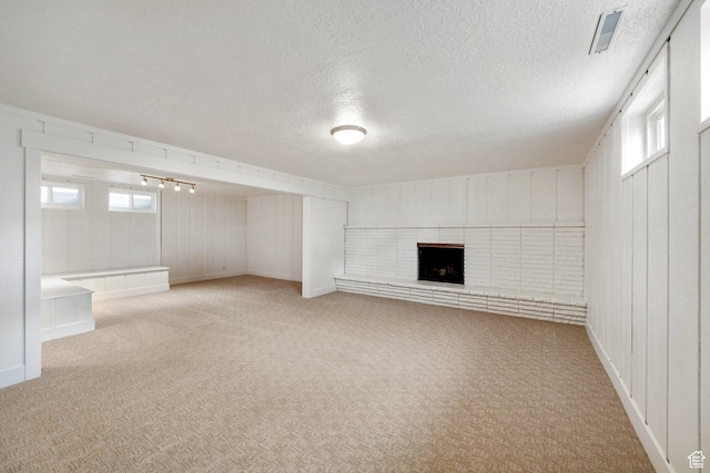 1767 N 1400 W, Provo, UT 84604 - below grade area with carpet flooring, a textured ceiling, and a fireplace