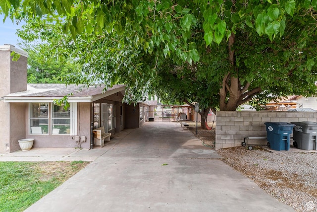 283 S 400 W, Hurricane, UT 84737 - view of side of home featuring stucco siding and a chimney