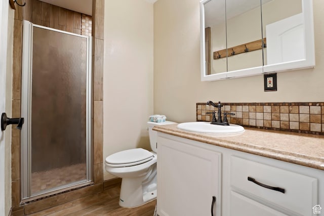 283 S 400 W, Hurricane, UT 84737 - bathroom with wood finished floors, vanity, a shower stall, and decorative backsplash