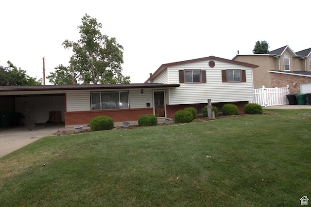 547 E 6295 S, Murray, UT 84107 - split level home with brick siding, a carport, and concrete driveway