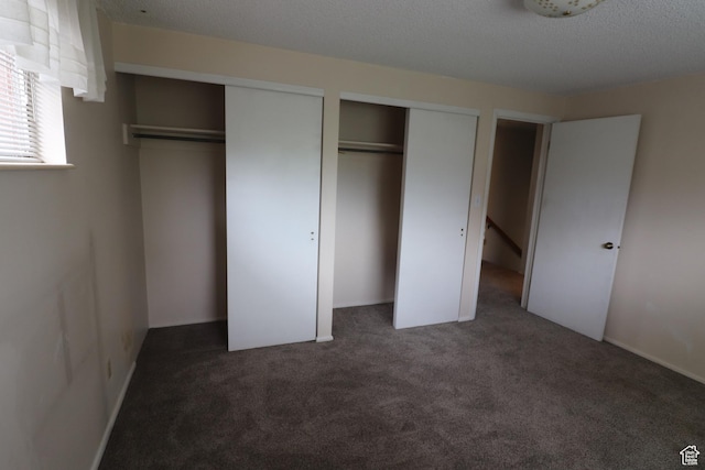 547 E 6295 S, Murray, UT 84107 - unfurnished bedroom featuring two closets and carpet flooring