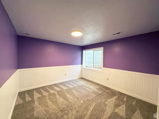 34840 N 10265 E, Fairview, UT 84629 - carpeted empty room with a wainscoted wall and a textured ceiling