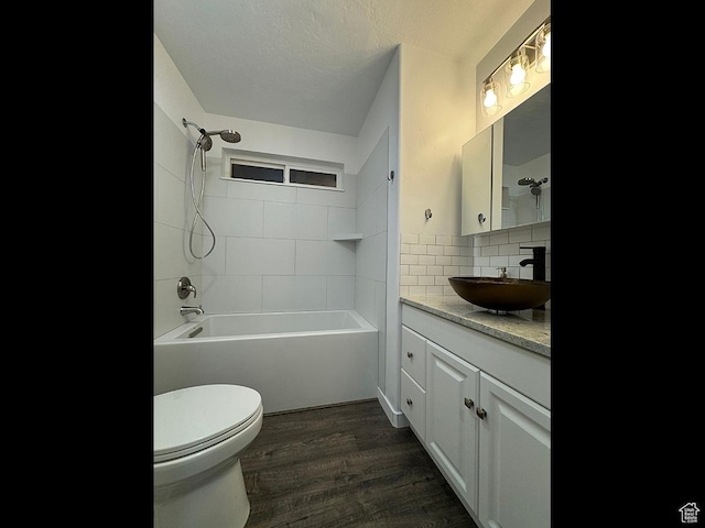 34840 N 10265 E, Fairview, UT 84629 - full bathroom featuring vanity, washtub / shower combination, wood finished floors, and decorative backsplash