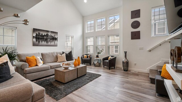 319 N 750 E, Vineyard, UT 84059 - living room featuring wood finished floors, high vaulted ceiling, stairs, and recessed lighting