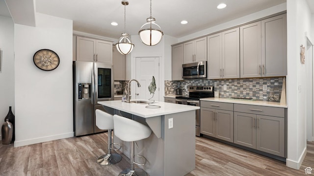 319 N 750 E, Vineyard, UT 84059 - kitchen featuring stainless steel appliances, gray cabinetry, tasteful backsplash, light wood-style floors, and recessed lighting