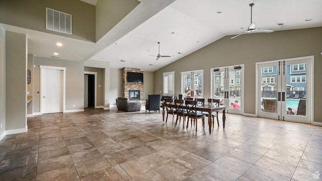319 N 750 E, Vineyard, UT 84059 - dining room featuring ceiling fan, french doors, a stone fireplace, high vaulted ceiling, and recessed lighting