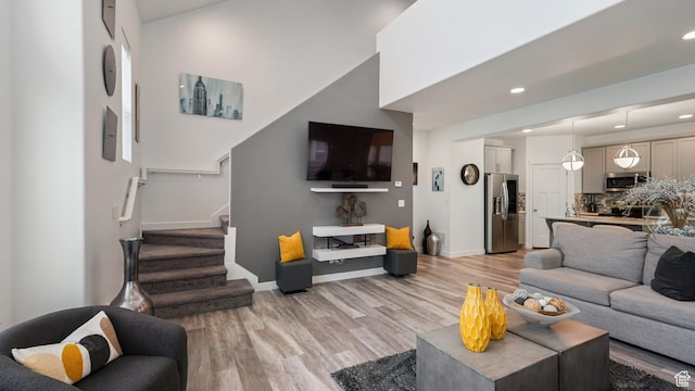 319 N 750 E, Vineyard, UT 84059 - living room featuring light wood-style floors, stairs, and recessed lighting