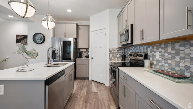 319 N 750 E, Vineyard, UT 84059 - kitchen with stainless steel appliances, gray cabinets, light countertops, backsplash, and recessed lighting