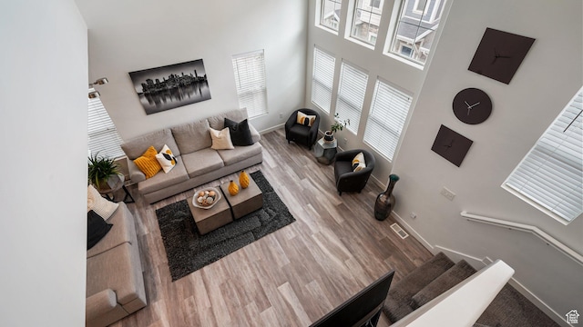 319 N 750 E, Vineyard, UT 84059 - living area featuring wood finished floors and a towering ceiling