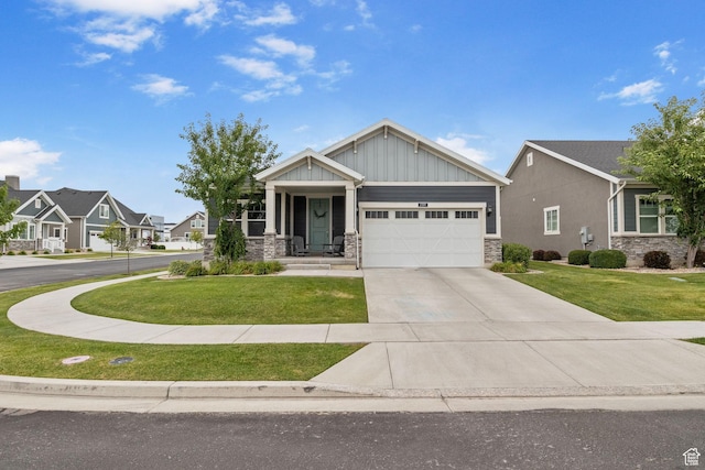 2319 N Penstemon Way, Lehi, UT 84043 - craftsman inspired home with stone siding, a front lawn, a garage, and driveway