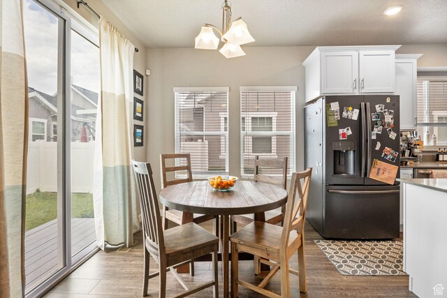2319 N Penstemon Way, Lehi, UT 84043 - dining space with a chandelier, wood finished floors, and recessed lighting