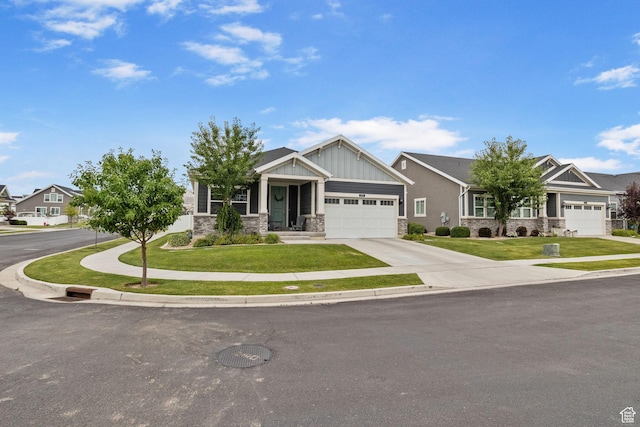 2319 N Penstemon Way, Lehi, UT 84043 - craftsman house featuring stone siding, a garage, a front lawn, and board and batten siding