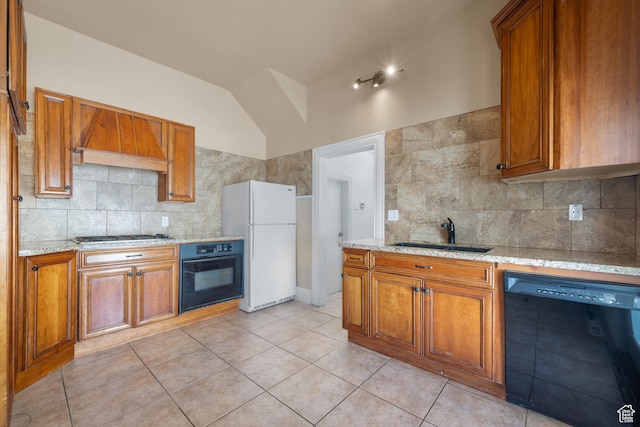 1145 Kensington Ave, Salt Lake City, UT 84105 - kitchen featuring black appliances, brown cabinetry, custom range hood, backsplash, and lofted ceiling