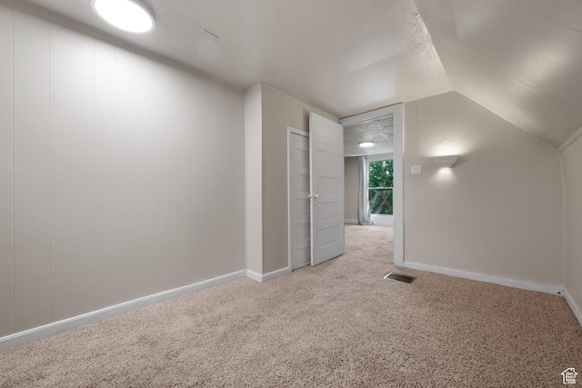 1145 Kensington Ave, Salt Lake City, UT 84105 - additional living space with light carpet and vaulted ceiling