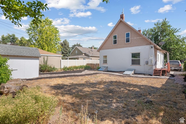 1145 Kensington Ave, Salt Lake City, UT 84105 - back of property with an outdoor structure and a chimney