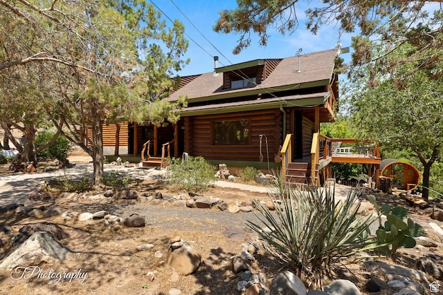 503 S Cottonwood Dr, Brookside, UT 84782 - view of front of property with log exterior and a wooden deck