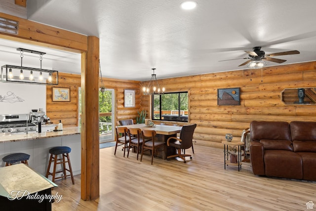 503 S Cottonwood Dr, Brookside, UT 84782 - dining space with a chandelier, light wood-style flooring, log walls, and ceiling fan