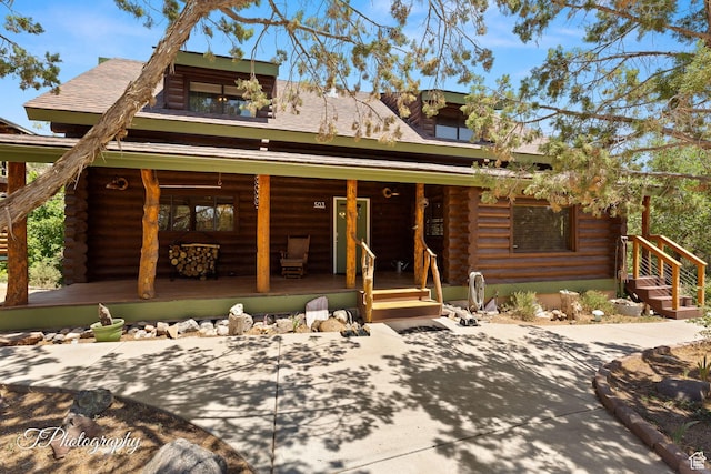 503 S Cottonwood Dr, Brookside, UT 84782 - log-style house featuring log siding and a porch