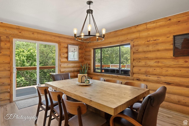 503 S Cottonwood Dr, Brookside, UT 84782 - dining space with a chandelier, light wood-type flooring, and log walls