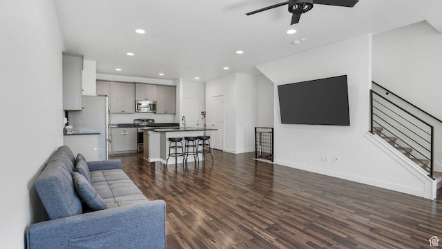 5681 W Pelican Ridge Ln, Salt Lake City, UT 84118 - living area featuring recessed lighting, dark wood-style floors, a ceiling fan, and stairs