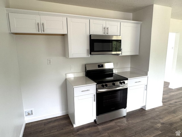 434 W Alta View Dr S, Midvale, UT 84047 - kitchen featuring appliances with stainless steel finishes, dark wood-type flooring, white cabinetry, and light countertops