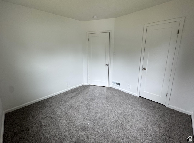 434 W Alta View Dr S, Midvale, UT 84047 - unfurnished bedroom featuring dark colored carpet and baseboards