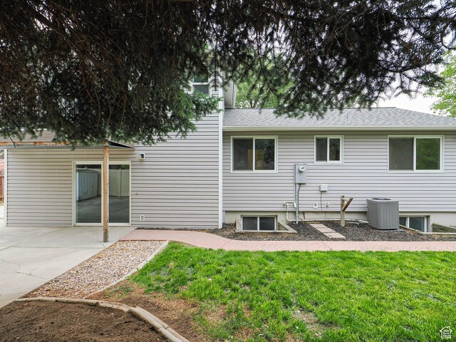 9971 S Borg Dr, Sandy, UT 84092 - rear view of property with a patio, a lawn, and a shingled roof