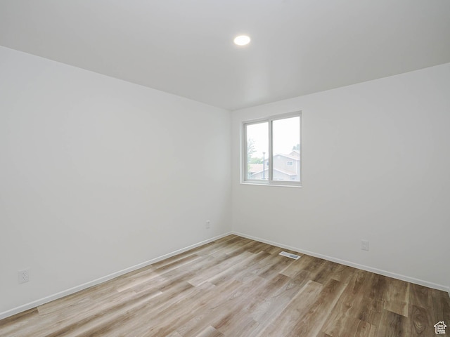 9971 S Borg Dr, Sandy, UT 84092 - spare room with light wood-type flooring and recessed lighting