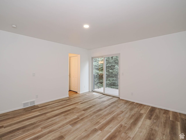 9971 S Borg Dr, Sandy, UT 84092 - spare room with light wood finished floors and recessed lighting