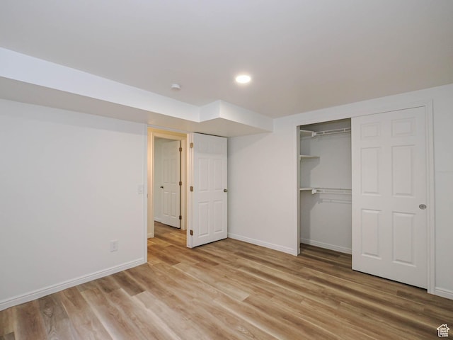 9971 S Borg Dr, Sandy, UT 84092 - unfurnished bedroom with light wood finished floors, a closet, and recessed lighting