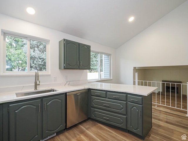 9971 S Borg Dr, Sandy, UT 84092 - kitchen featuring dishwasher, a peninsula, light countertops, lofted ceiling, and dark wood finished floors