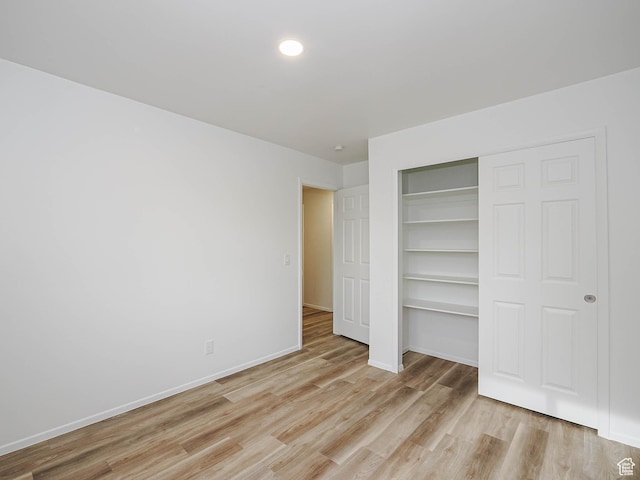 9971 S Borg Dr, Sandy, UT 84092 - unfurnished bedroom with light wood-style flooring, a closet, and recessed lighting