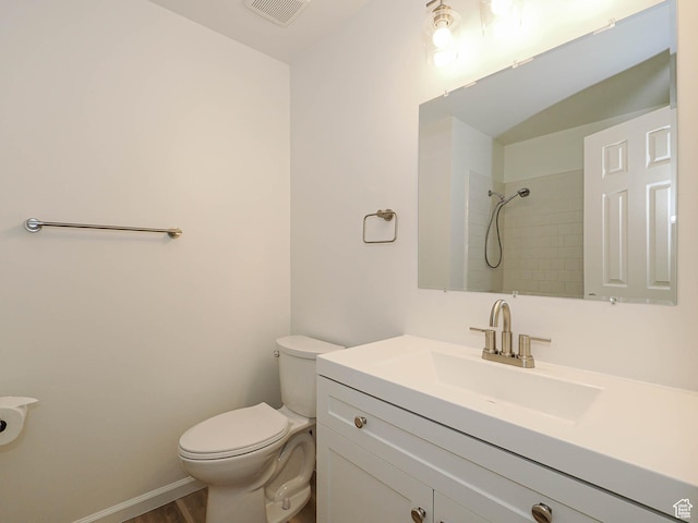 9971 S Borg Dr, Sandy, UT 84092 - bathroom with vanity, tiled shower, and wood finished floors